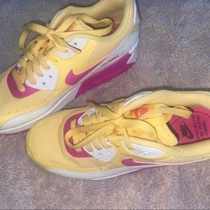 Pink, yellow, & white nike air max shoes